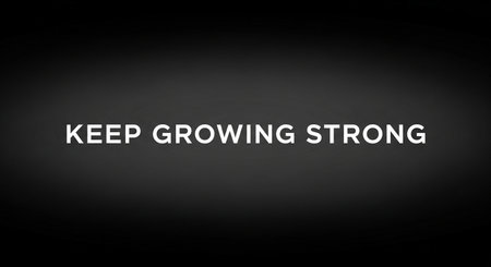 Keep growing strong. Motivational quote on a black background.の写真素材