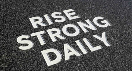 The words "RISE STRONG DAILY" written in white on a black backgroundの写真素材