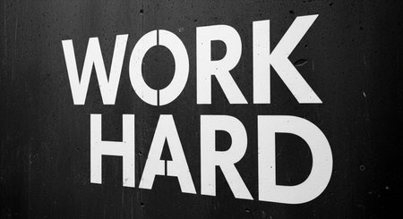 Work hard sign painted on a wall. Motivational concept.の写真素材