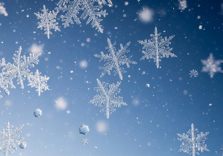 Falling snowflakes on blue sky background. Christmas background.の写真素材