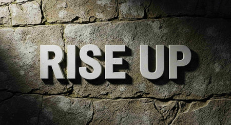 The word ""Rise Up"" written in stone letters.の写真素材