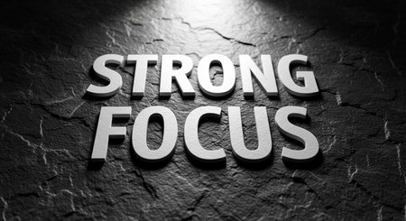 The word Strong Focus in white letters on a dark textured backgroundの写真素材