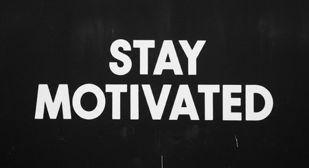 Stay Motivated sign on a black wall. Motivational conceptの写真素材