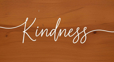 Handwritten word on a brown wooden background.の写真素材