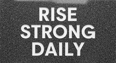 Rise Strong Day. Black and white words on asphalt background.の写真素材