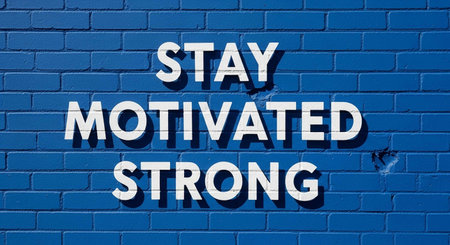 Conceptual hand writing showing Stay Motivated Staying Strong. Business photo showcasing Motivate to accomplish a desired goal Brick Wall art like Graffiti motivational call written on the wallの写真素材