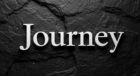 Journey text on black stone background. Top view, flat lay.の写真素材