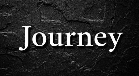 Journey text on black textured background. Top view, flat lay.の写真素材