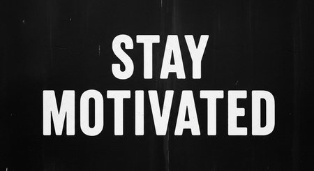 Stay Motivated sign on a black wall. Motivation concept.の写真素材