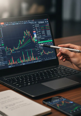 Businessman analyzing investment charts with laptop computer. Accounting and finance concept.