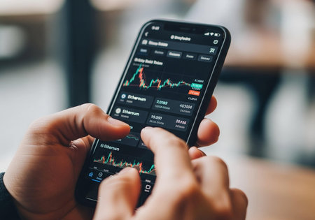 Smartphone with stock market chart on the screen. Business and finance concept.の写真素材