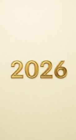 golden number on a beige background for the new yearの写真素材