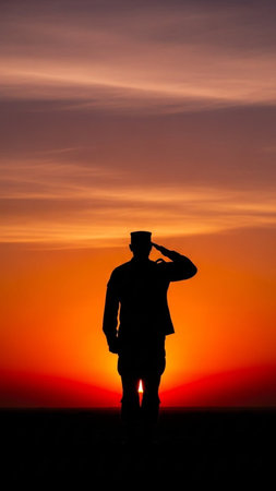Silhouette of a man greeting against a beautiful sunset.の写真素材