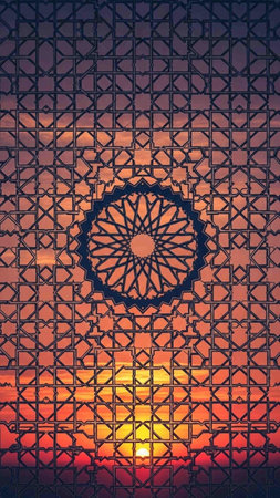 Sunset behind the lattice of the window. Toned.の写真素材