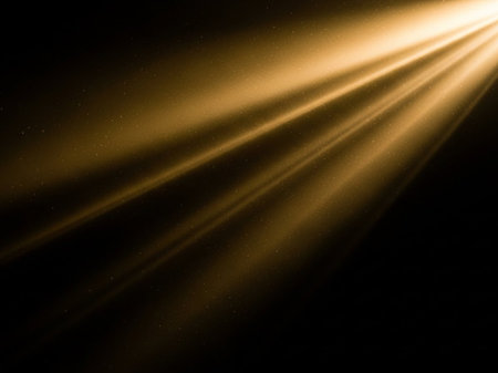 golden rays of light on a black background. abstract background.の写真素材