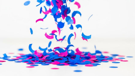 Confetti and streamers on white background. Festive party conceptの写真素材