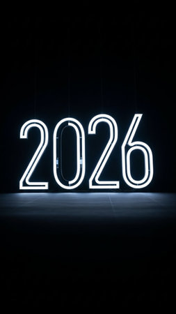 New year 2021 written in white neon light on a black background.の写真素材