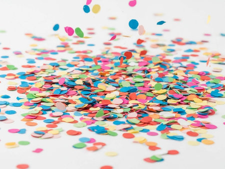 Colorful confetti on a white background. Festive background.の写真素材