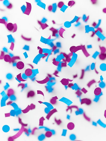 Confetti on white background. Festive background. Abstract texture.の写真素材