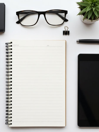 White office desk table with laptop, smartphone, supplies and coffee cup. Top view with copy space, flat layの写真素材