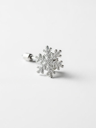 Silver snowflake on a white background. Minimalist design.