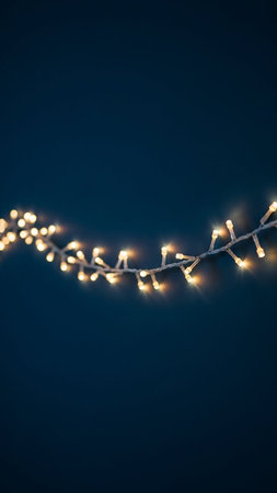 Christmas lights on dark blue background. Glowing garland. New Year and Christmas.の写真素材