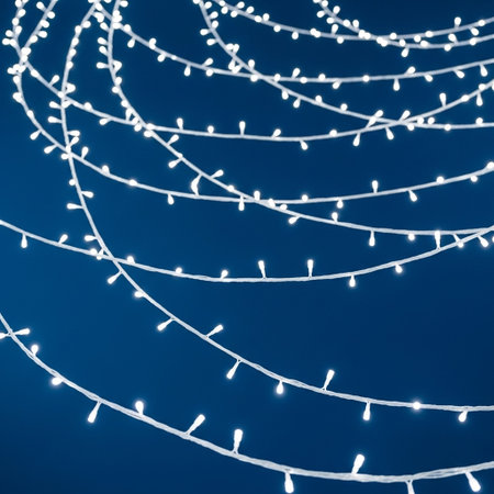 Christmas lights on a blue background. Festive decoration. New Year.