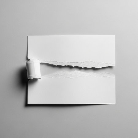 Torn white paper on grey background with copy space for your messageの写真素材