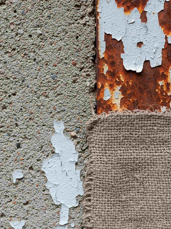 Rusty corrugated metal texture with burlap textile and flaking paintの写真素材