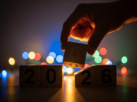 Wooden cubes with number 2016 and hand. New Year concept.の写真素材