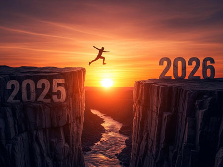 Happy new year concept. Happy man jumping over the cliff to the new yearの写真素材