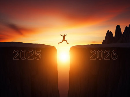 Silhouette of man jumping from cliff to the new year 2026の写真素材