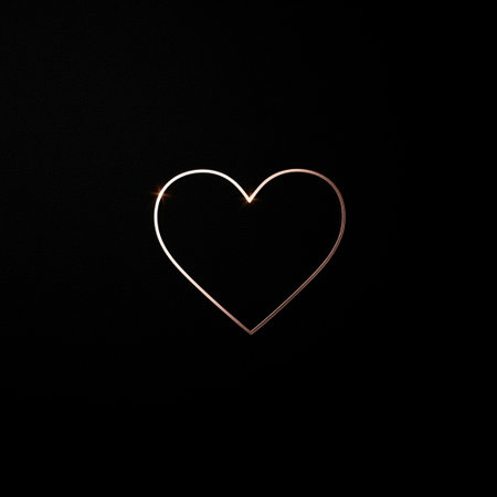 A delicate, glowing heart outline shines brightly against a dark background, symbolizing love and affection in a simple yet striking visual representation.の写真素材