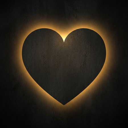 A heart shape cut out of a dark surface glows with a warm, golden light, creating a striking contrast against the black background, evoking feelings of love and warmth.の写真素材