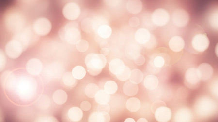 A dreamy, soft pink background with blurred bokeh lights, creating a warm and cozy atmosphere, perfect for adding a touch of elegance to designs.の写真素材