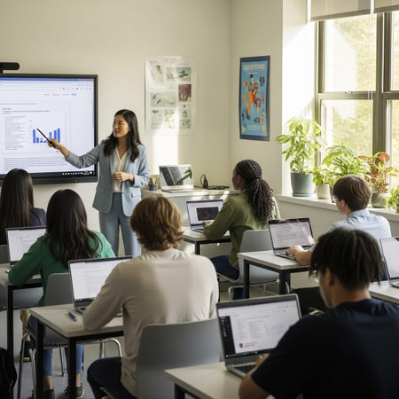 A teacher stands confidently in front of a classroom, pointing to a screen displaying a bar graph while students sit at desks with laptops, engaged in learning.の写真素材