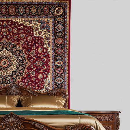 Interior of a bedroom with a bed and a carpet on the wall
