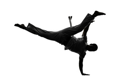 one man breakdancer dancing in silhouette studio isolated on white backgroundの写真素材