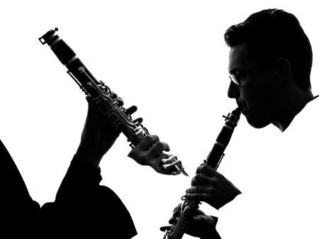 Silhouette of a man playing the on white backgroundの写真素材