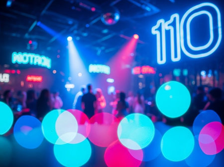 Blurred image of crowd at nightclub and bokeh background.