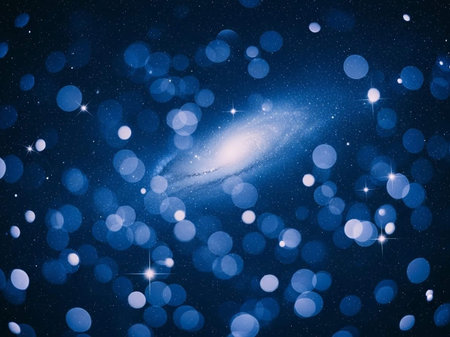 Abstract blue background with bokeh defocused lights and stars.