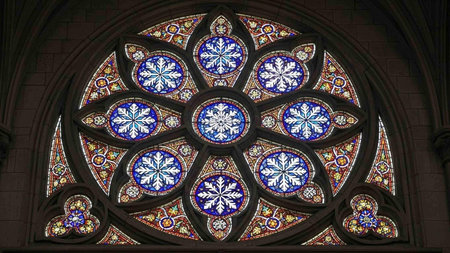 Stained glass window in Notre Dame Cathedral, Paris, France.