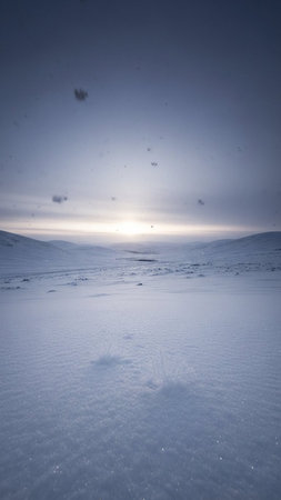 Beautiful winter sunset over a snow covered field in the Carpathian Mountains