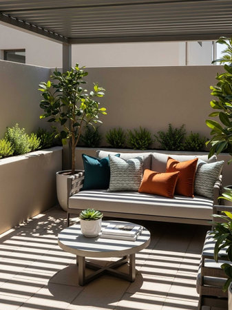 Modern terrace with sofa and pillows in the garden. Nobody inside