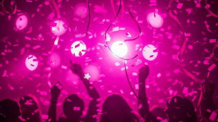 Colorful party background with bokeh lights and silhouettes of people