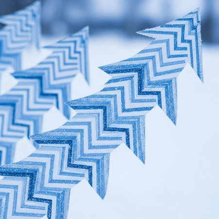 blue christmas tree on snow background, closeup photo with shallow dof