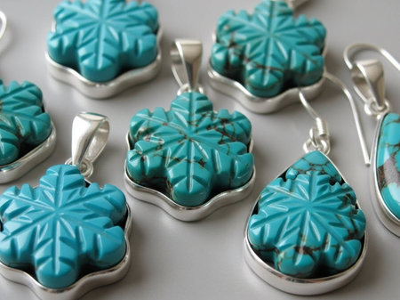 Turquoise earrings in a row on a white background.の写真素材