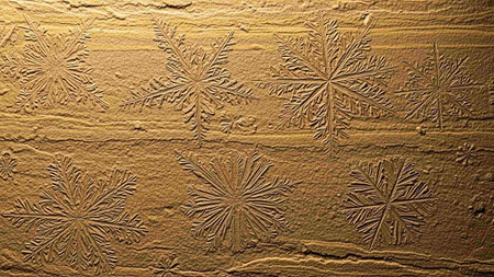 Beautiful snowflakes on the wall. Christmas background. Toned.