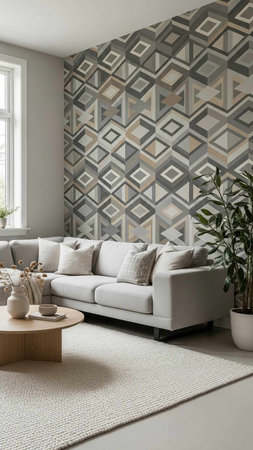 A modern living room with a geometric patterned accent wall and a comfortable gray couch