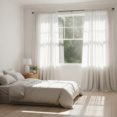 A serene and peaceful bedroom with a large window and white curtainsの写真素材